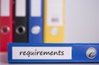 © WavebreakmediaMicro - Requirements on blue business binder