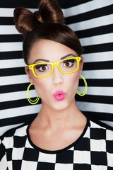 Wall Mural - Attractive young surprised woman wearing glasses