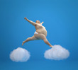 © Musicman80 - Fat man soaring in the clouds.