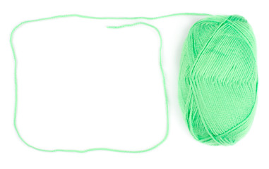 Wall Mural - yarn skein of green color on white background