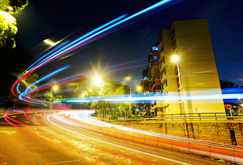 Wall Mural - Fast moving car light on road