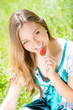 © stormy - Young beautiful girl eating strawberries