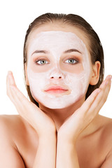 Woman with clay facial mask