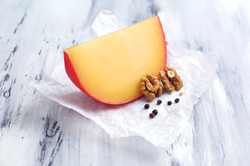 Tasty Italian cheese on wooden table