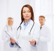 © Syda Productions - calm female doctor with clipboard