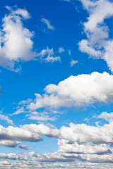 Wall Mural - white fluffy clouds in blue sky