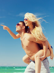 Canvas Print - couple having fun on the beach