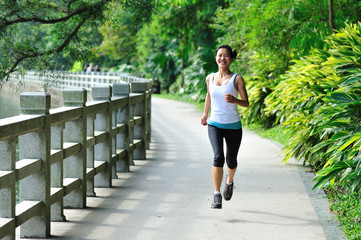 fitness healthy lifestyle young woman jogging in park