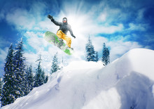 Snowboarder Jump Against Sky And Trees