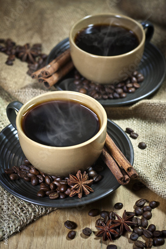 Fototapeta na wymiar Two cups of coffee with spices