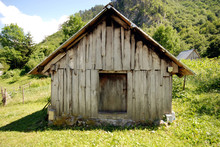 Abandoned Barn In Mountain Countryside