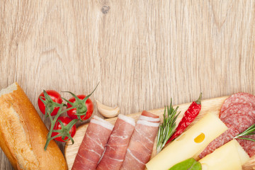 Wall Mural - Cheese, prosciutto, bread, vegetables and spices