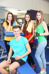 Sticker - Group of people relaxing after training in gym