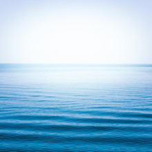 Blue Sea With Waves And Clear Blue Sky