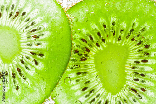 Naklejka na szybę sliced kiwi covered with bubbles