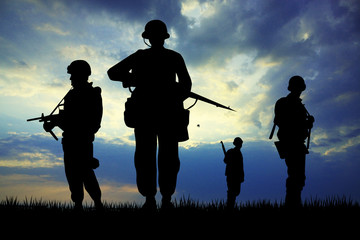 Wall Mural - Soldiers silhouette at sunset