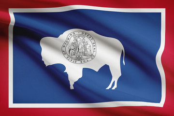 Wall Mural - Series of ruffled flags of US states. State of Wyoming.