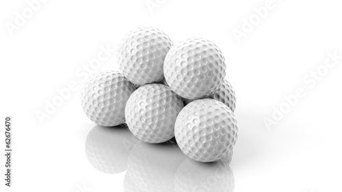 Obraz na płótnie canvas trzyczęściowy "tryptyk" Piłka golfowa w stos na białym tle