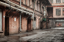 Old Industrial Street View With Red Brick Facades And Tubes