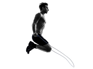 Wall Mural - young man exercising jumping rope silhouette