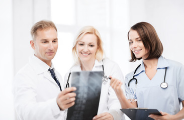 Wall Mural - doctors looking at x-ray