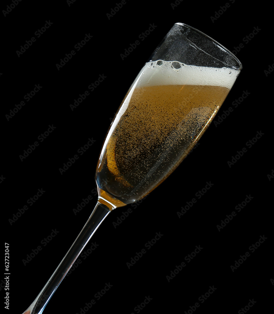 Glass of champagne, on black background