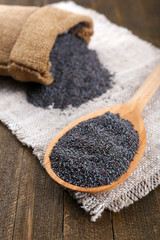 Poster - Poppy seeds in spoon on table close-up