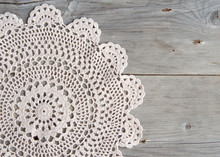 Crochet Doily Over Old Grey Wood