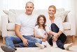 © Syda Productions - parents and little girl sitting on floor at home