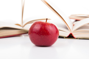 Wall Mural - open books with red apple