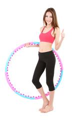 Wall Mural - Woman doing exercises with hula hoop isolated on white