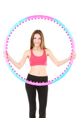 Wall Mural - Woman doing exercises with hula hoop isolated on white