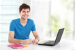 © Odua Images - college student using his laptop