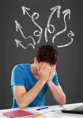 confused young man covering his head
