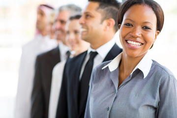 Wall Mural - young african businesswoman with business team