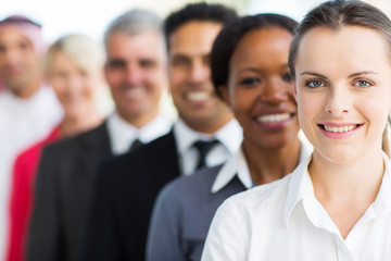 Wall Mural - businesswoman with colleagues standing in a row