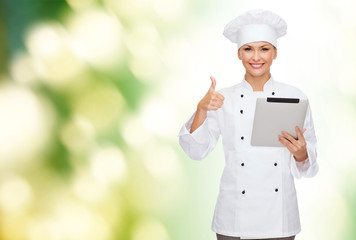 Poster - smiling female chef with tablet pc computer