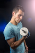 © Maria Vazquez - Muscular young man with dumbbells