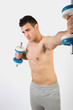 © Maria Vazquez - Muscular young man with dumbbells