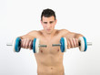 © Maria Vazquez - Muscular young man with dumbbells