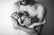 Father holding a newborn baby