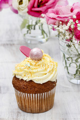 Wall Mural - Beautiful cupcakes decorated with yellow and orange sprinkles