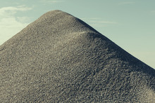 A Large Gravel Pile, Material Used For Construction And Maintaining Roads.