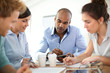 © goodluz - Young business people meeting around table