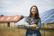 © Mint Images - Woman standing outdoors at farm