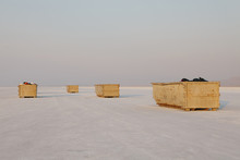 Large Yellow Garbage Containers On Bonneville Salt Flats, Dusk, Near Wendover. 
