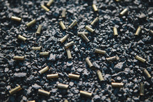 Discarded Bullet Shells On The Ground.