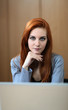© BGStock72 - Young woman by the laptop