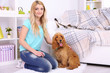 © Africa Studio - Beautiful young woman with cocker spaniel in room