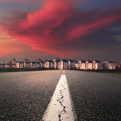 Canvas Print - Open road. Entry into the city at sunset